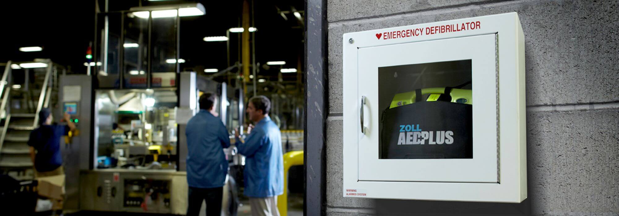 Rescuer using a ZOLL AED Plus defibrillator on a patient